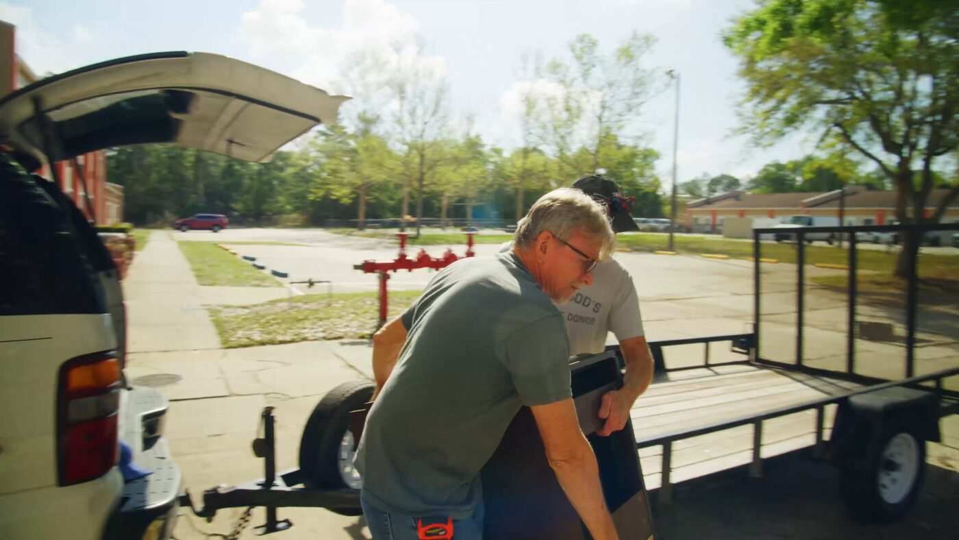 Video production crew preparing equipment and gear for an on-location commercial shoot