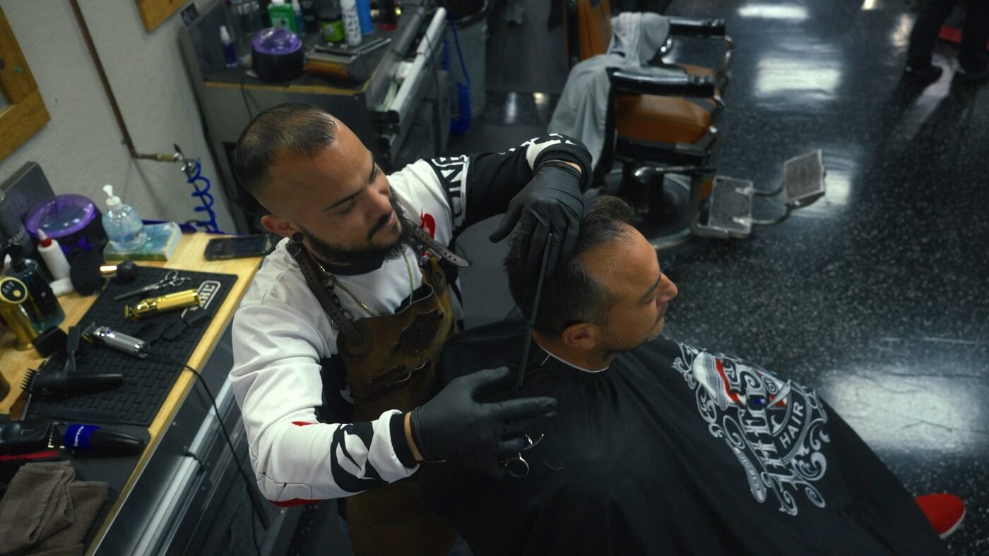 Lifestyle brand photography — barber at work in barbershop